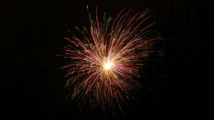 Bright fireworks explosion lit up the night sky, creating a colorful display for celebration and entertainment. Perfect for events, festivals, or New Year's celebrations, capturing the excitement of fireworks.