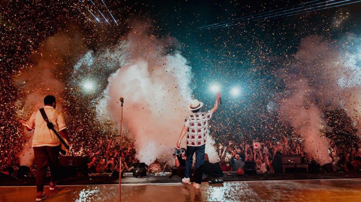 Bruno Mars entertaining a crowd on stage