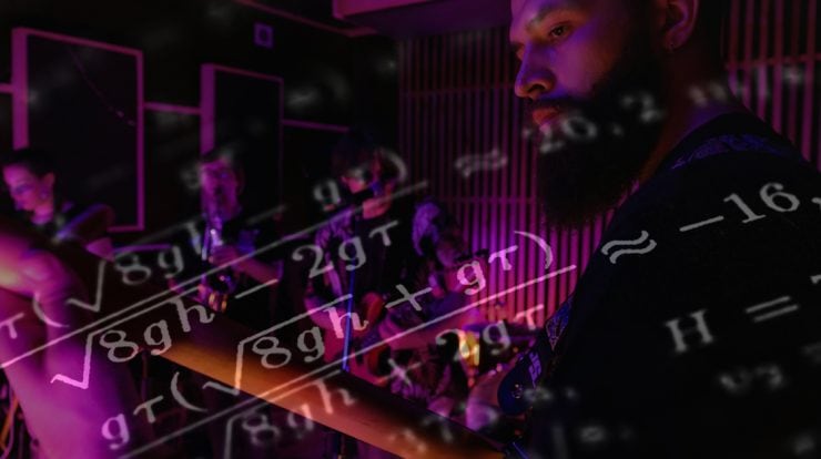 musician playing with band, and math floats around him.