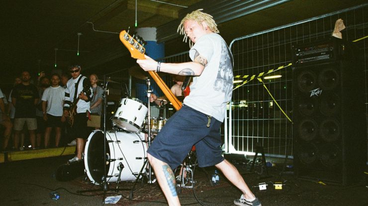 punk band playing in a DIY venue