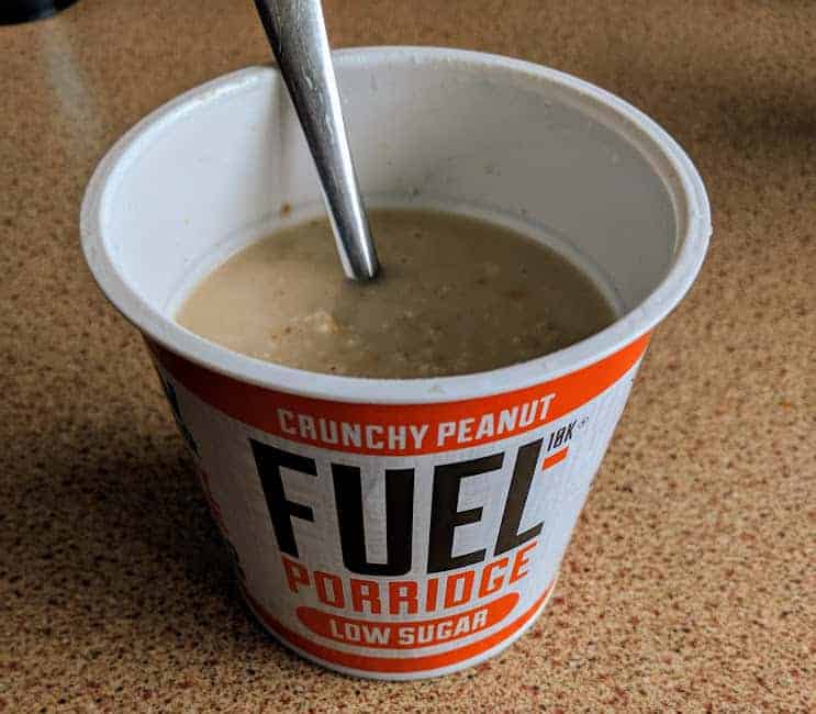 fuel crunchy peanut porridge pot on worktop made up with a spoon in