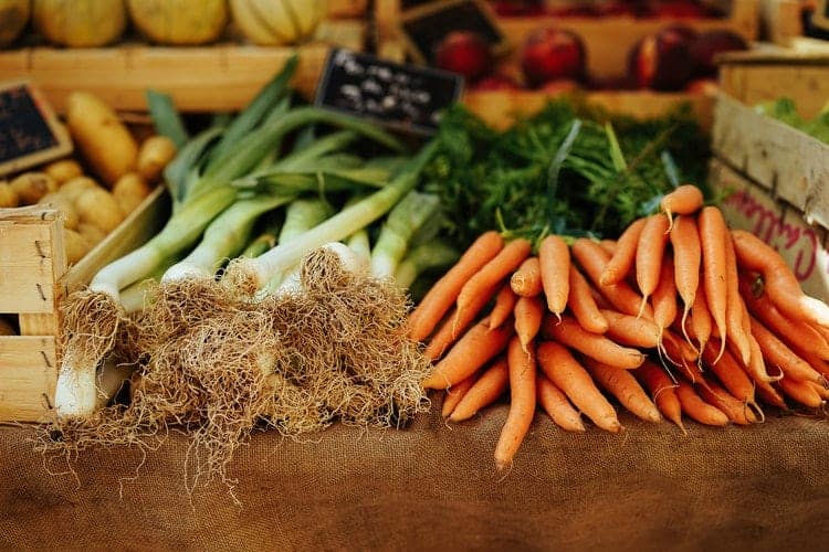 vegetables freshly picked on a wooden table.