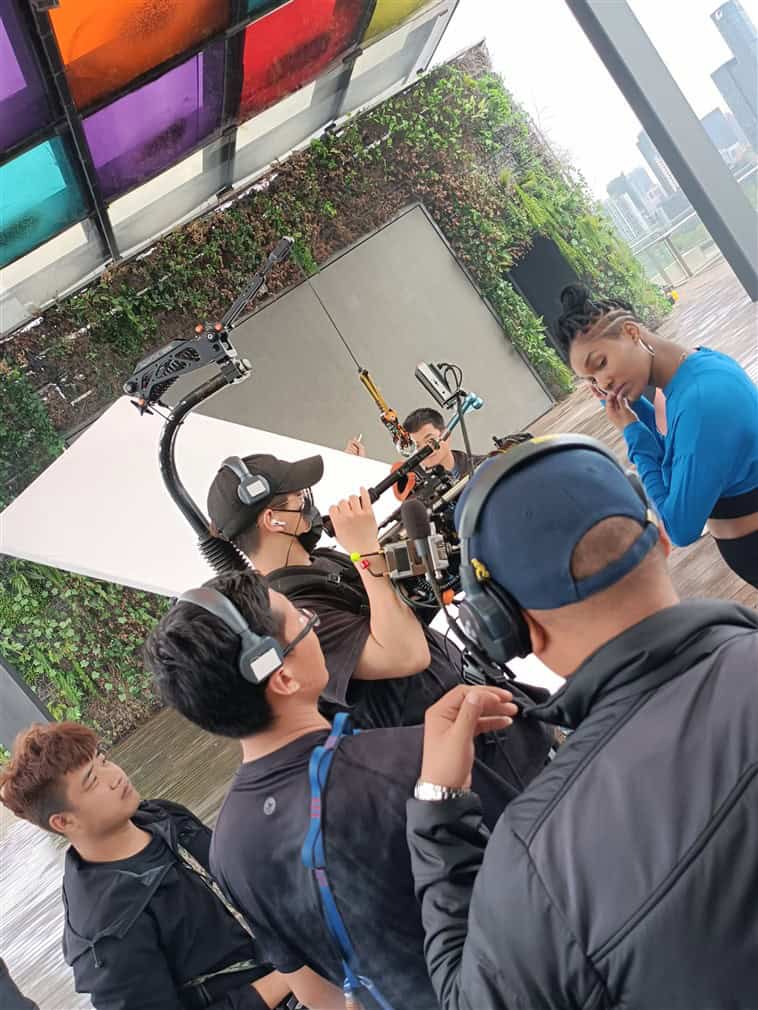 Bilingual crew setting up camera rig during shoot in Shanghai