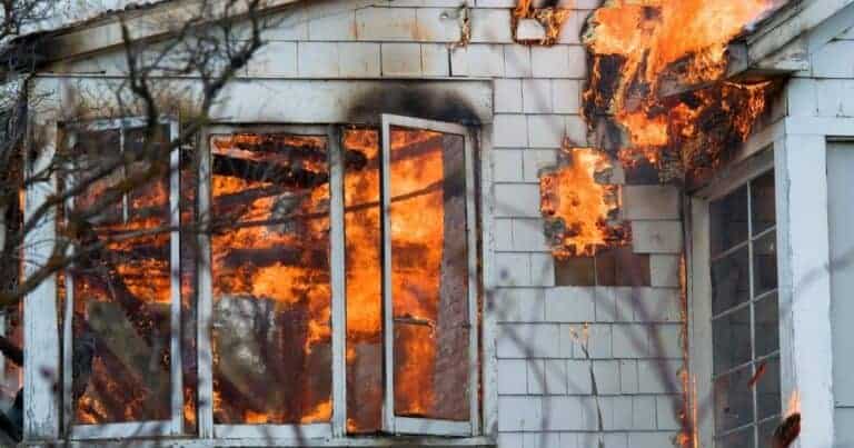 white house with flames shooting out the windows