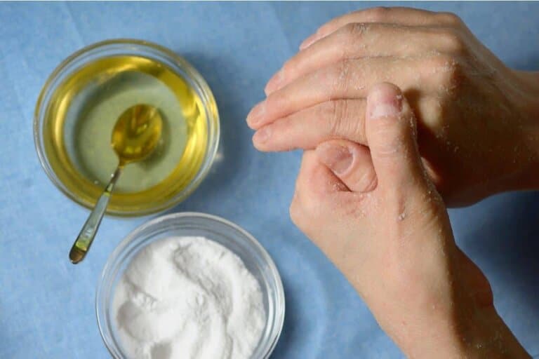 photo of woman rubbing baking soda and honey natural skin exfoliant