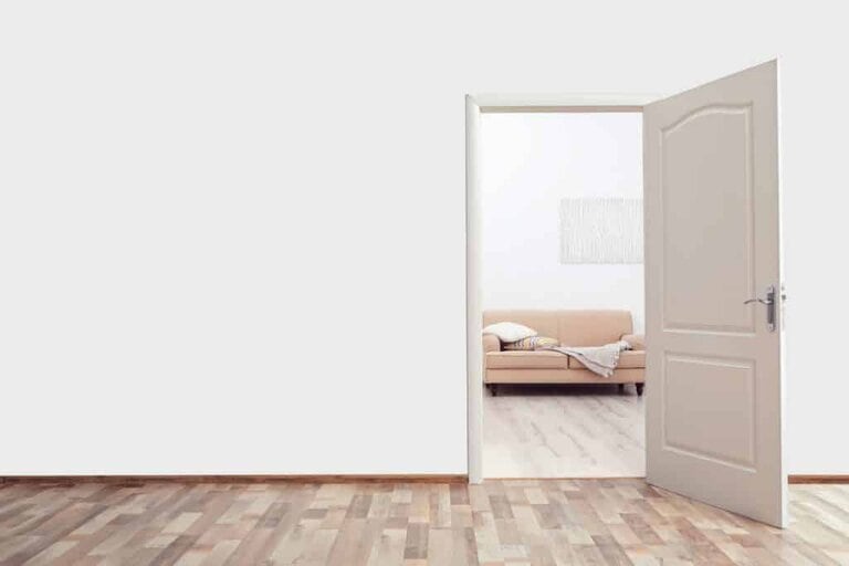 photo of light cream open door and chair in the next room