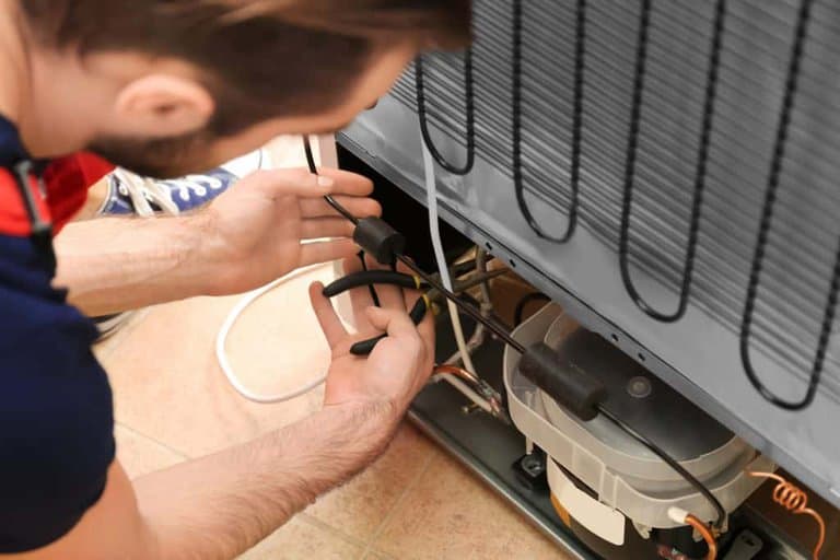 check condenser coils of freezer