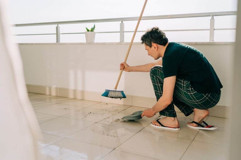 sweeping the balcony floor