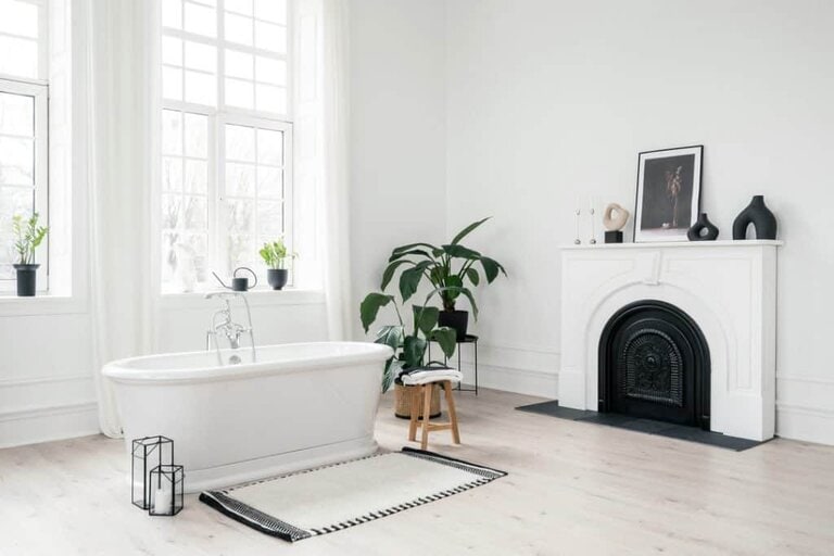 white rug in middle of bathroom