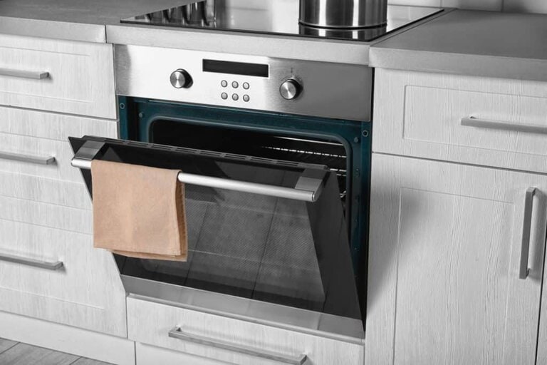 electric oven with white kitchen cabinets