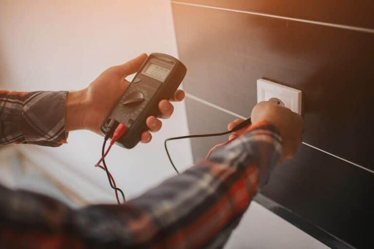 electrician checking amps