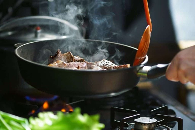 frying beef in steel pan