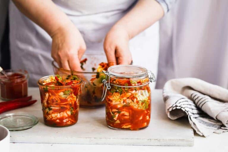 chef inspecting kimchi
