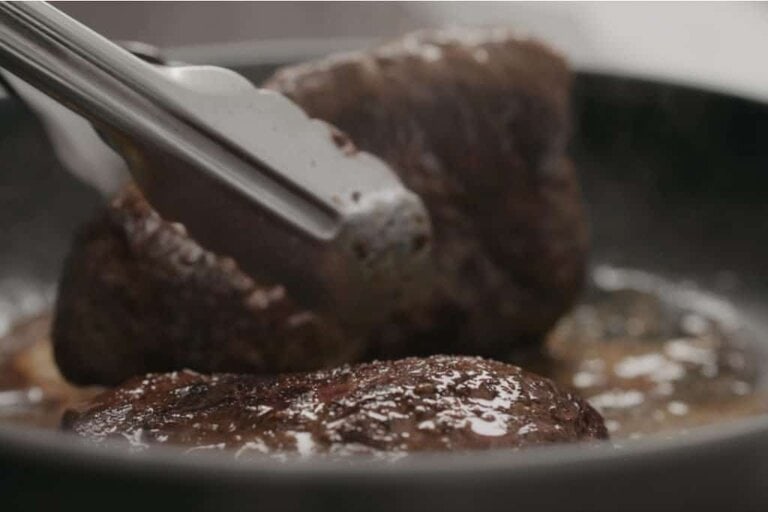 flipping beef on pan