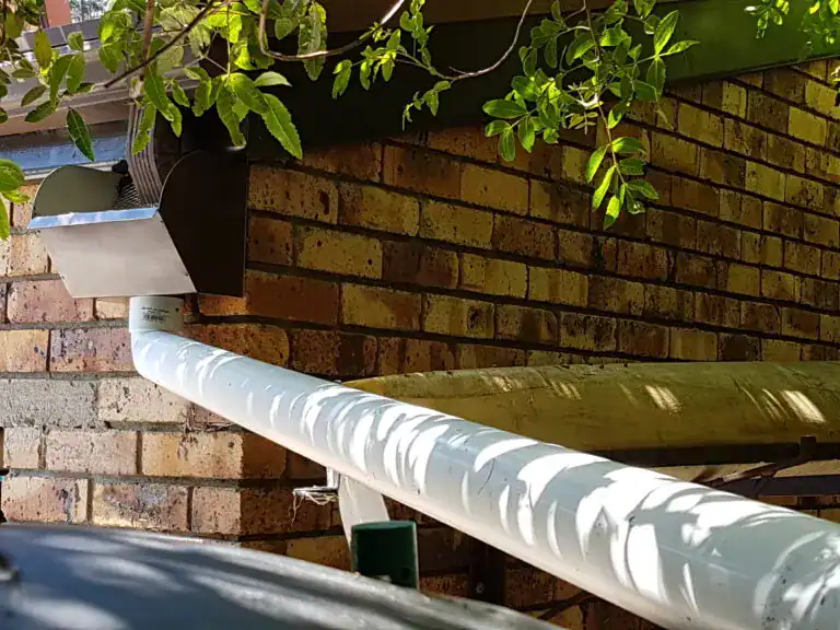 High-capacity industrial aluminium hopper box and round downpipe for efficient water management.