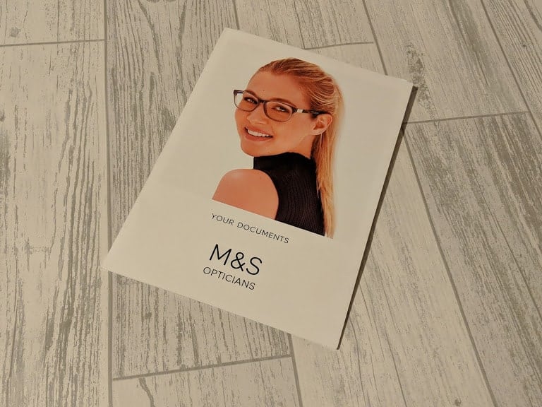 A folder of documents from the Marks and Spencer opticians