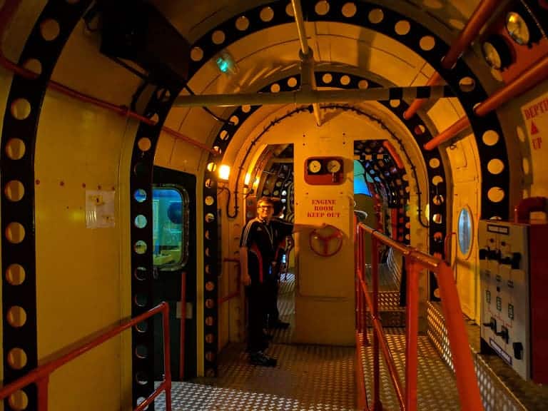 Ben inside a yellow submarine at the Beatles story