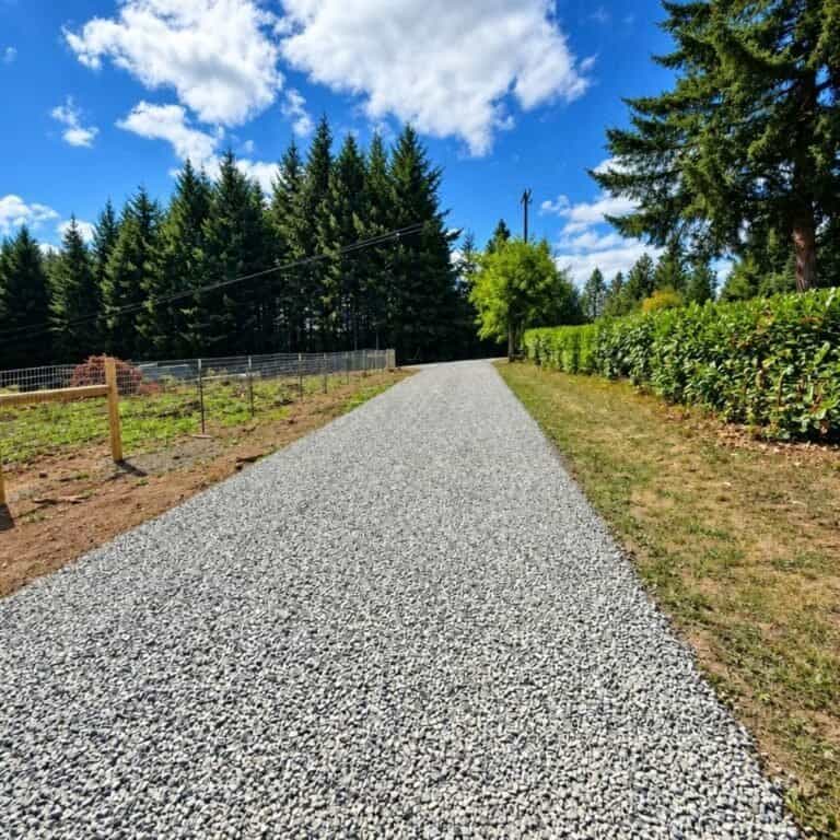 Long refinished gravel driveway along a fence line in St. Helens, Oregon