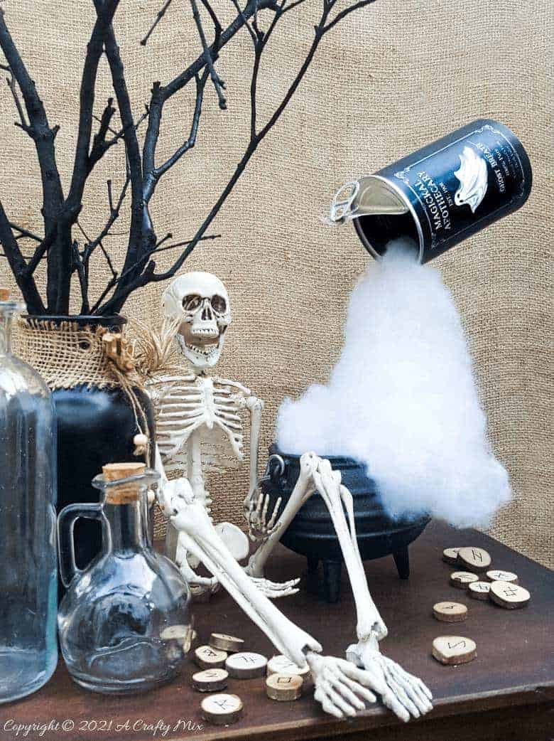 Add a little fun and mystery to your Halloween decor with this easy-to-make magical floating tin can filled with ghost breath. You don't need any special tools and it takes less than an hour to make too. #HalloweenDecor #HalloweenCrafts #ACraftyMix #FloatingTinCan