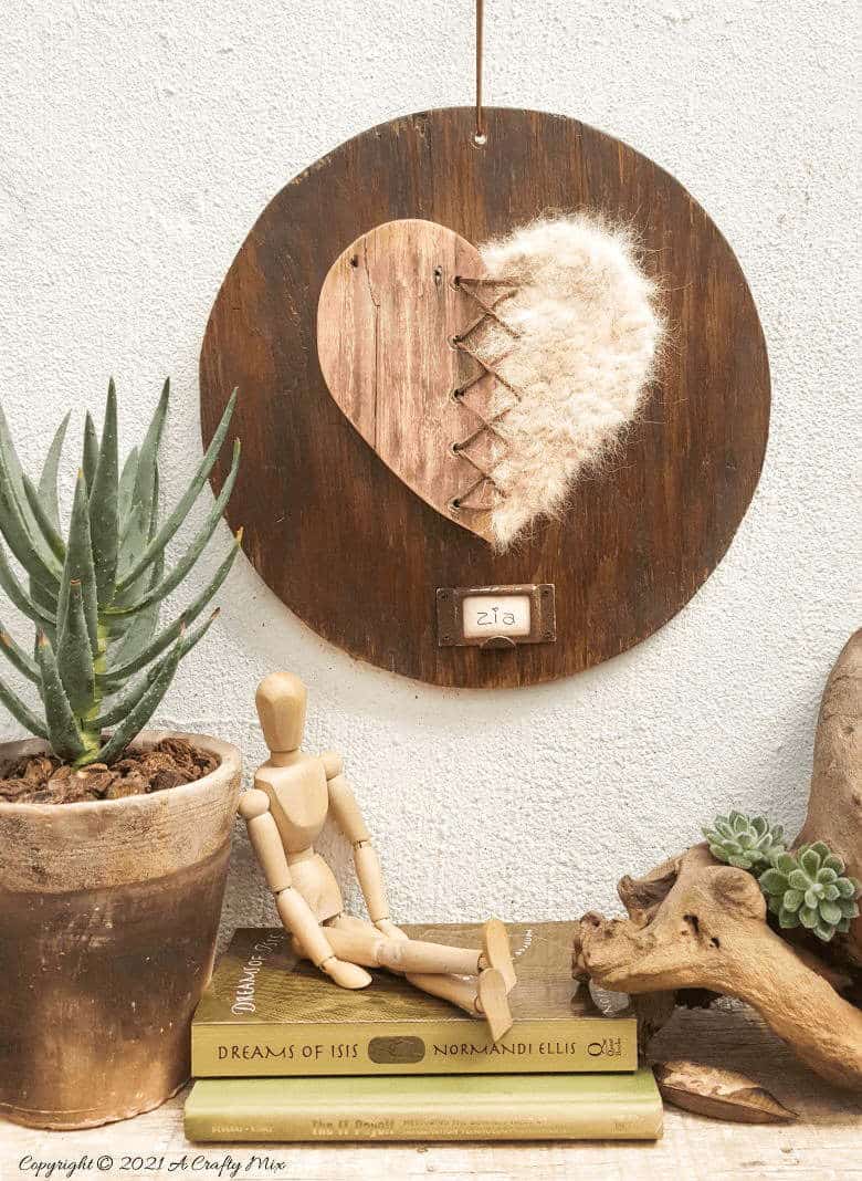 Our dogs shed a lot but instead of cursing them, I decided to make a spun pet hair heart using all the fur that our babies discard so lovingly all over our home. This tutorial will show you how you can turn your fur baby's shed hair into a precious keepsake and includes a video tutorial that will show you how to comb and spin pet hair. #PetCrafts #ACraftyMix #PetKeepsake