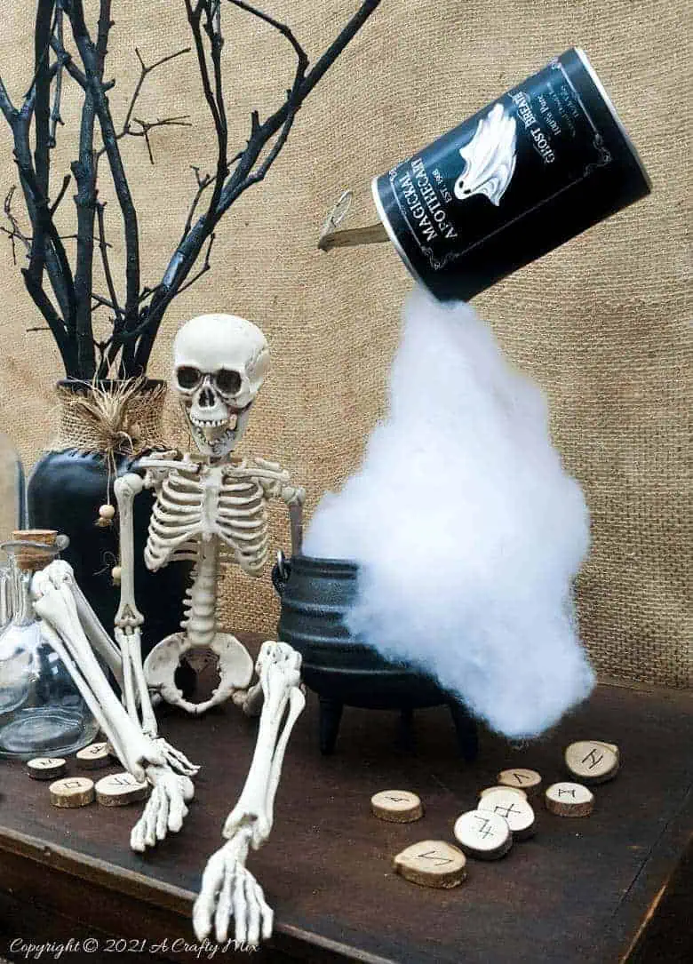Add a little fun and mystery to your Halloween decor with this easy-to-make magical floating tin can filled with ghost breath. You don't need any special tools and it takes less than an hour to make too. #HalloweenDecor #HalloweenCrafts #ACraftyMix #FloatingTinCan