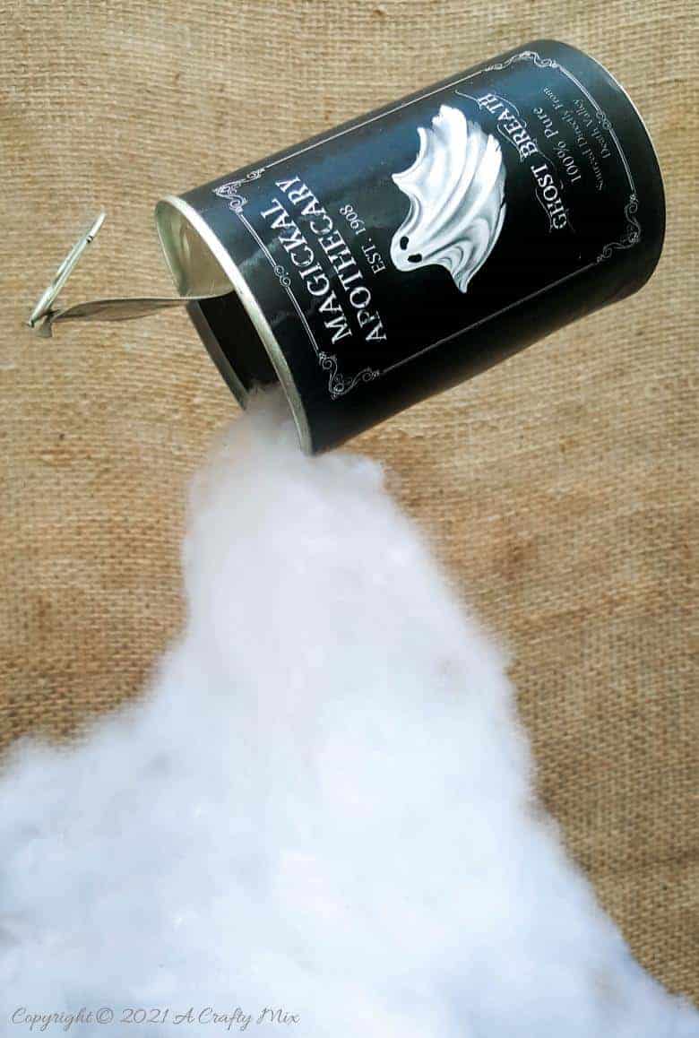 Add a little fun and mystery to your Halloween decor with this easy-to-make magical floating tin can filled with ghost breath. You don't need any special tools and it takes less than an hour to make too. #HalloweenDecor #HalloweenCrafts #ACraftyMix #FloatingTinCan