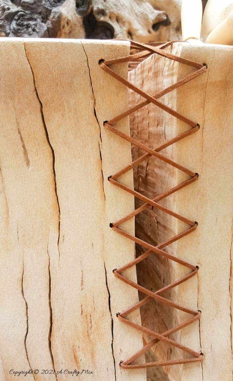 Do you have a gorgeous chunk of wood that’s developed a HUGE crack? Don't toss it out until you've seen how easy it is to turn a cracked wooden stump into a décor worthy feature. #HomeDecor #ACraftyMix #CrackedWood