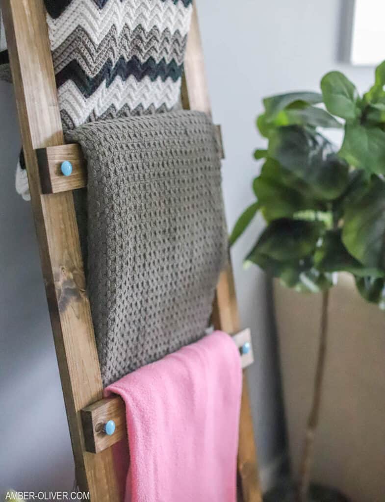 Wooden blanket ladder leaning against a wall