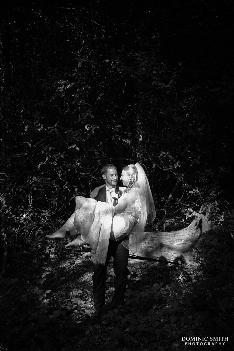 Groom carrying the Bride