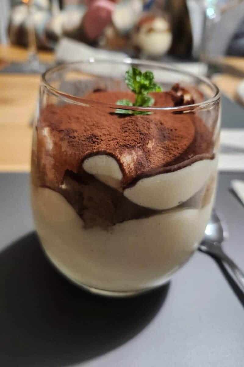 Tiramisu in tumbler glass.