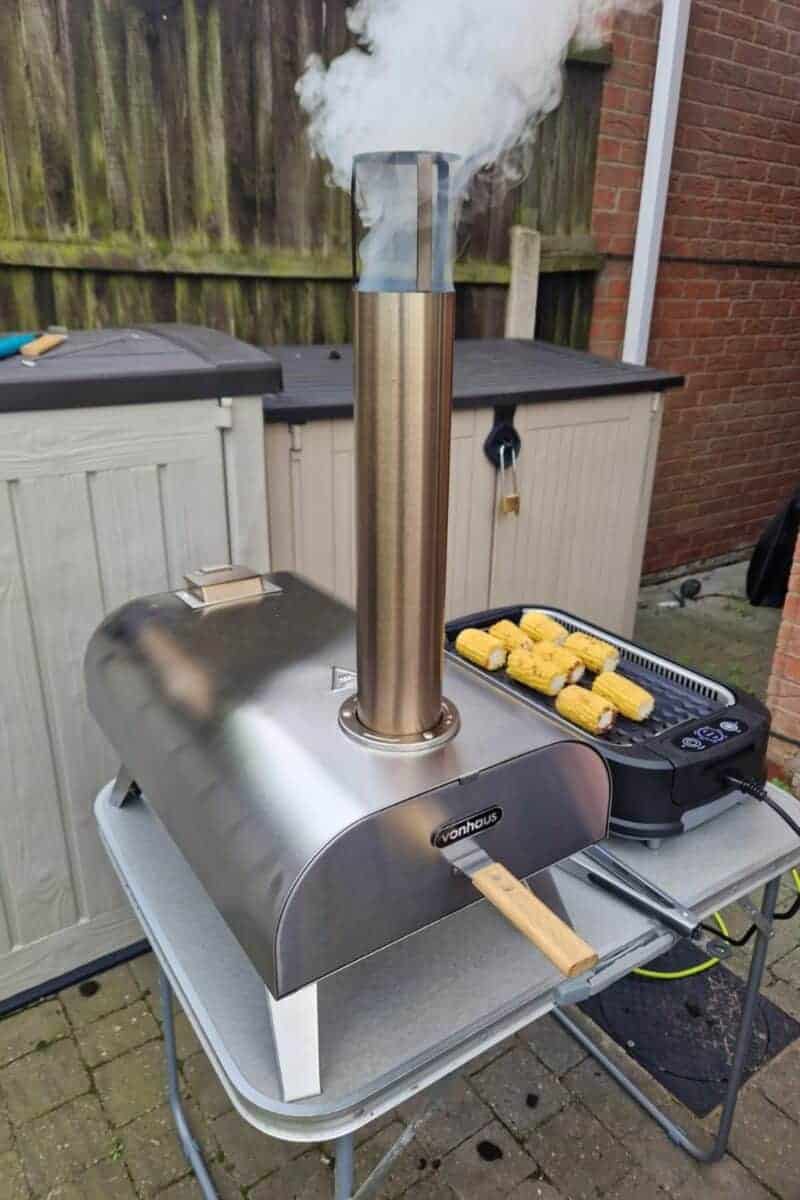 pizza oven with smoke coming out of the chimney