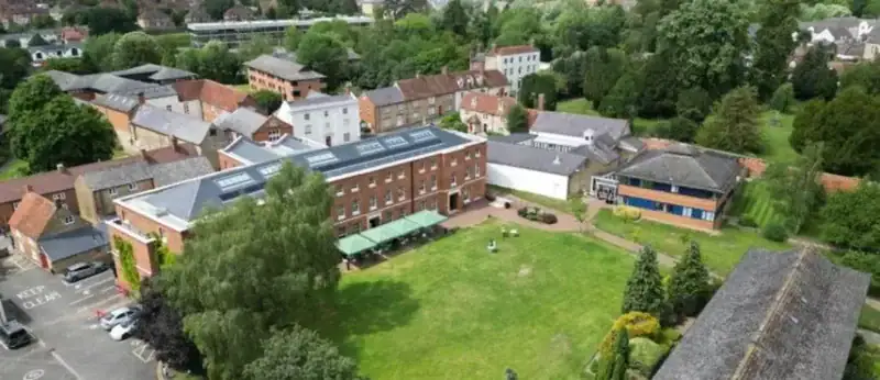 A bird’s-eye view of Buckingham’s campus, now running on one connected system from the software down to the infrastructure beneath it.
