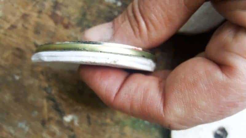 To bulk up the tin can tops use craft foam and glue on
