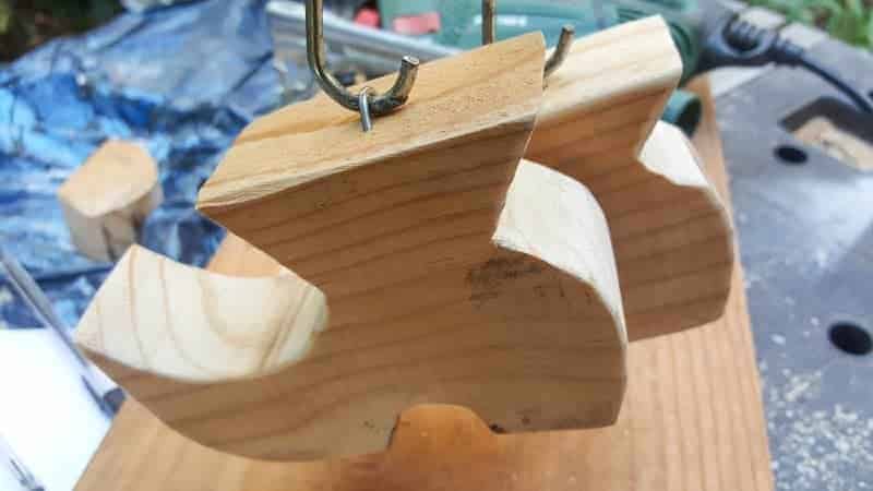 Hang the shoes from the spring using the fence posts nails