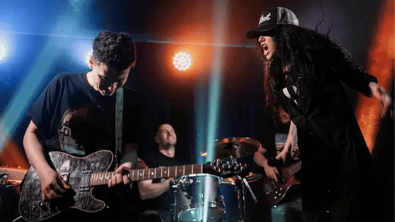 Young musicians performing live at a concert, highlighting music industry, live performance, and artist promotion on Hypebot.