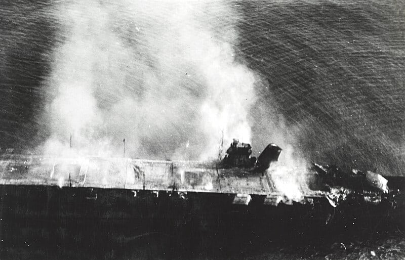 Burning Japanese carrier Hiryu on June 5, 1942, with a collapsed flight deck and damaged elevator after explosions during Midway.