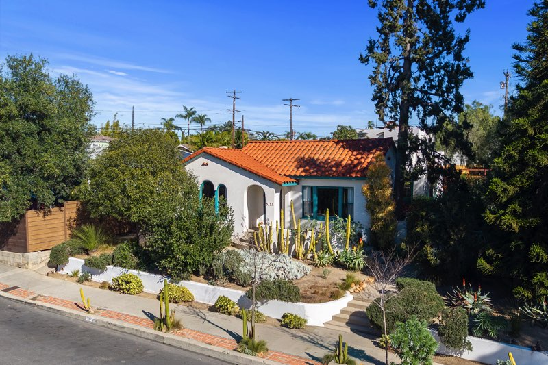 White stucco Spanish Revival Home and drought tolerant landscape