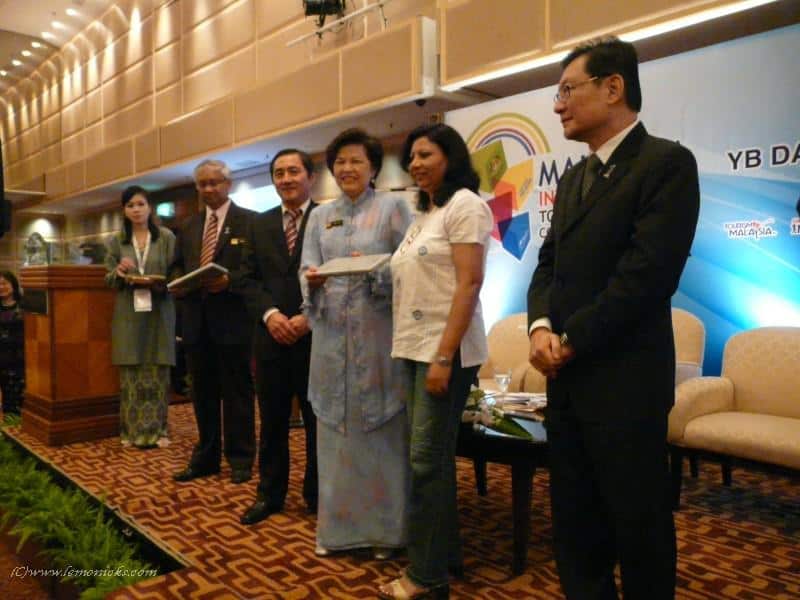 Receiving a memento from Minister of Tourism, Malaysia