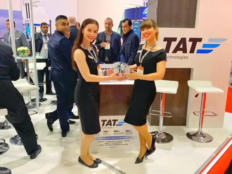Business professionals meeting inside a modern trade show booth