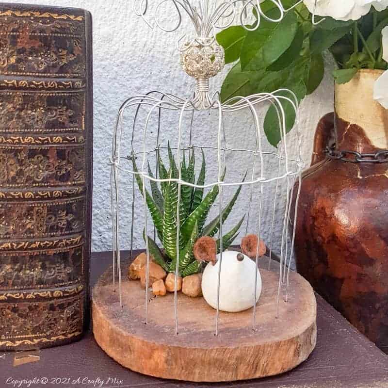 This easy to follow tutorial will show you how to make your own art deco wire bird cage. Made in a morning, it’s a fun way to add a little handcrafted glamour to you décor. #BirdCage #DIY #ACraftyMix