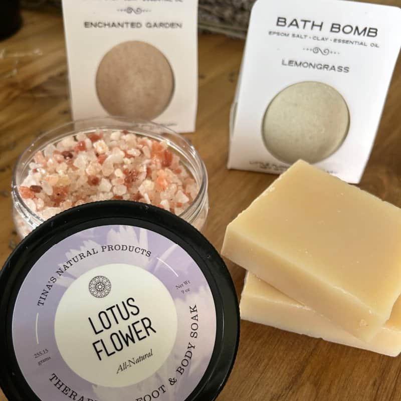 Handcrafted bath salts, lotus flower body soak, and lemongrass bath bomb.