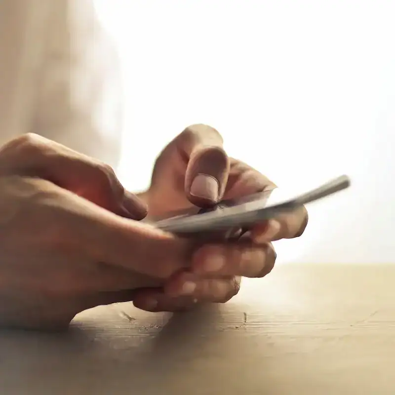 persons hands using a smartphone to get in touch