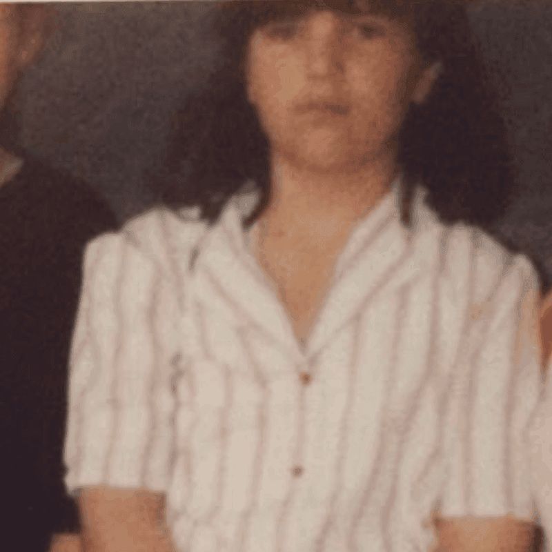 Jen aged 11 in a stripy blouse.