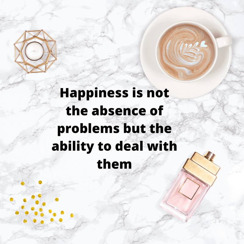 Marble background with a cup of coffee and perfume with black text overlaying it