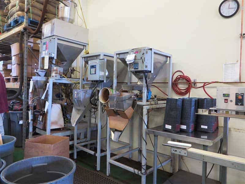Small-batch coffee weighers at a specialty coffee roasting operation