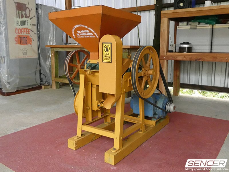 An older flywheel coffee batch weigher at Finca Tantum Galapagos, Ecuador