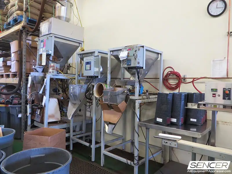 Small-batch coffee weighers at a specialty coffee roasting operation