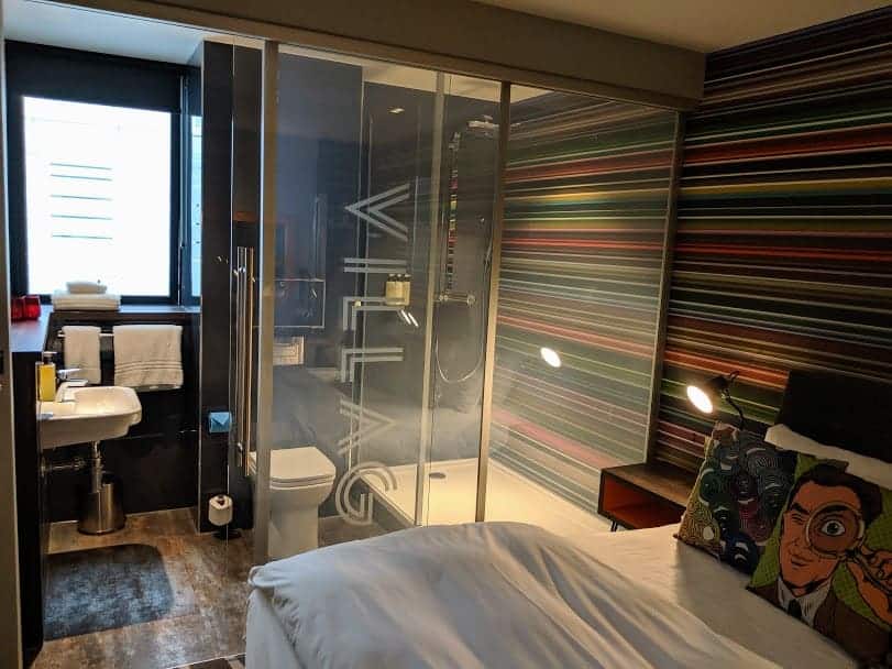 bed and shower room in club room at village hotel portsmouth