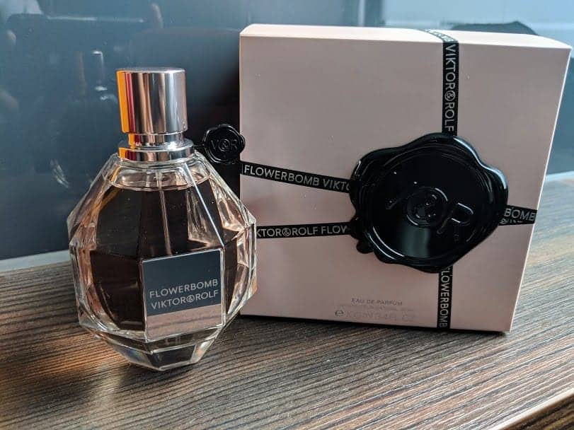flowerbomb perfume on a wooden table.