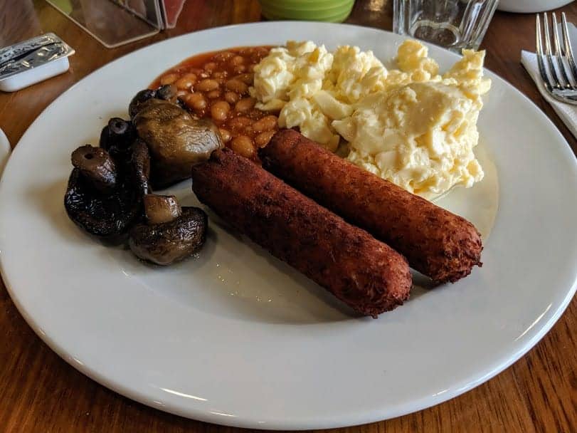 cooked breakfast on a white plate.